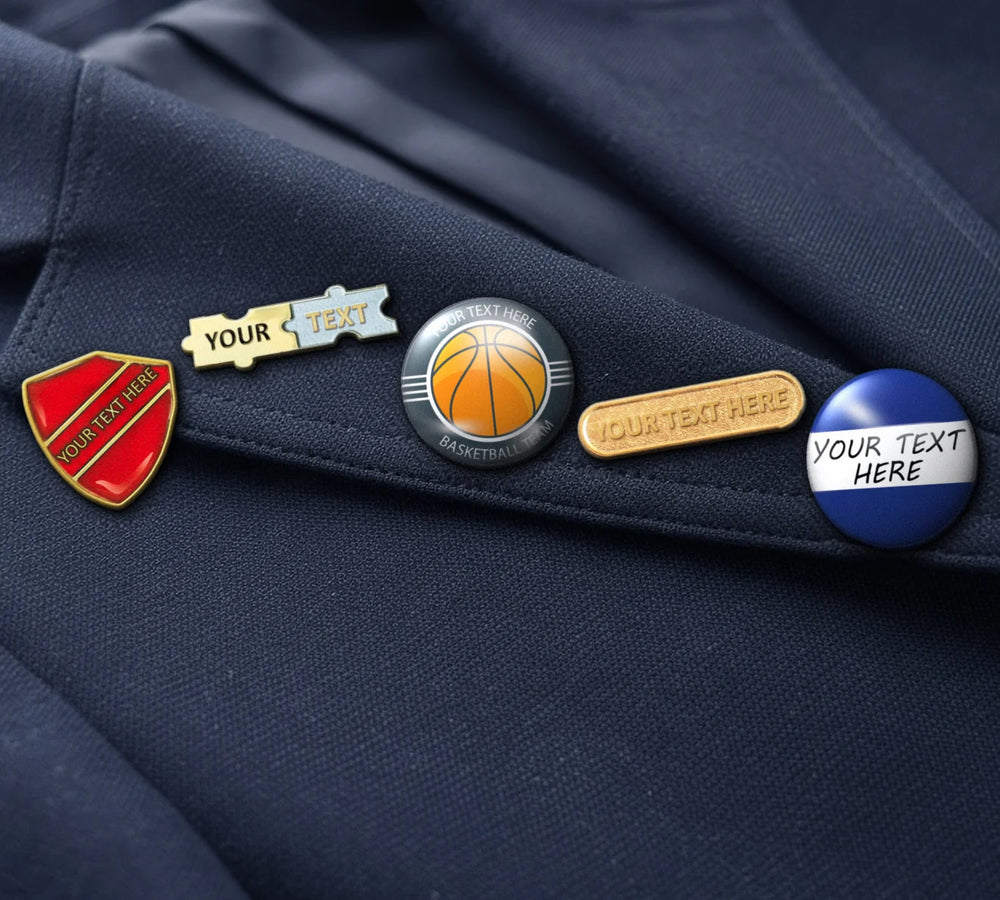 Personalised school badges, including a red enamelled shield, on a navy blazer lapel