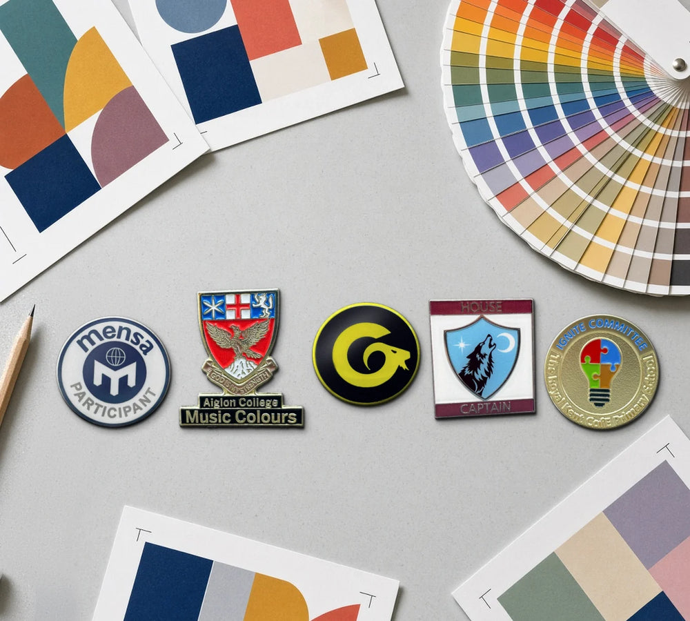 Custom made school badges on a designer's desk