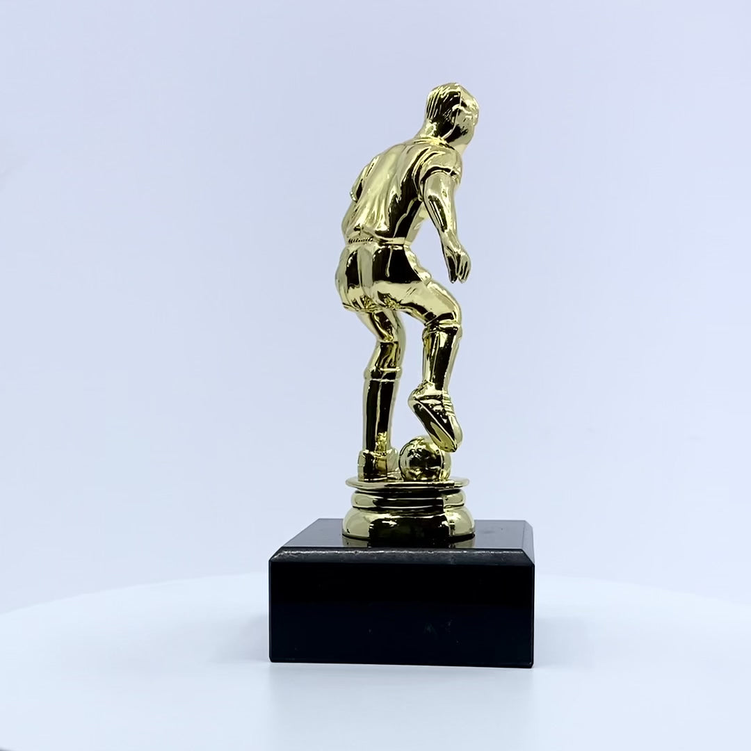 Load video: Dribbling Football Trophy with Marble Base Video by School Badges UK